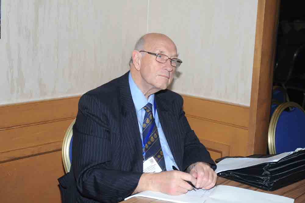 Delegate taking notes during a session