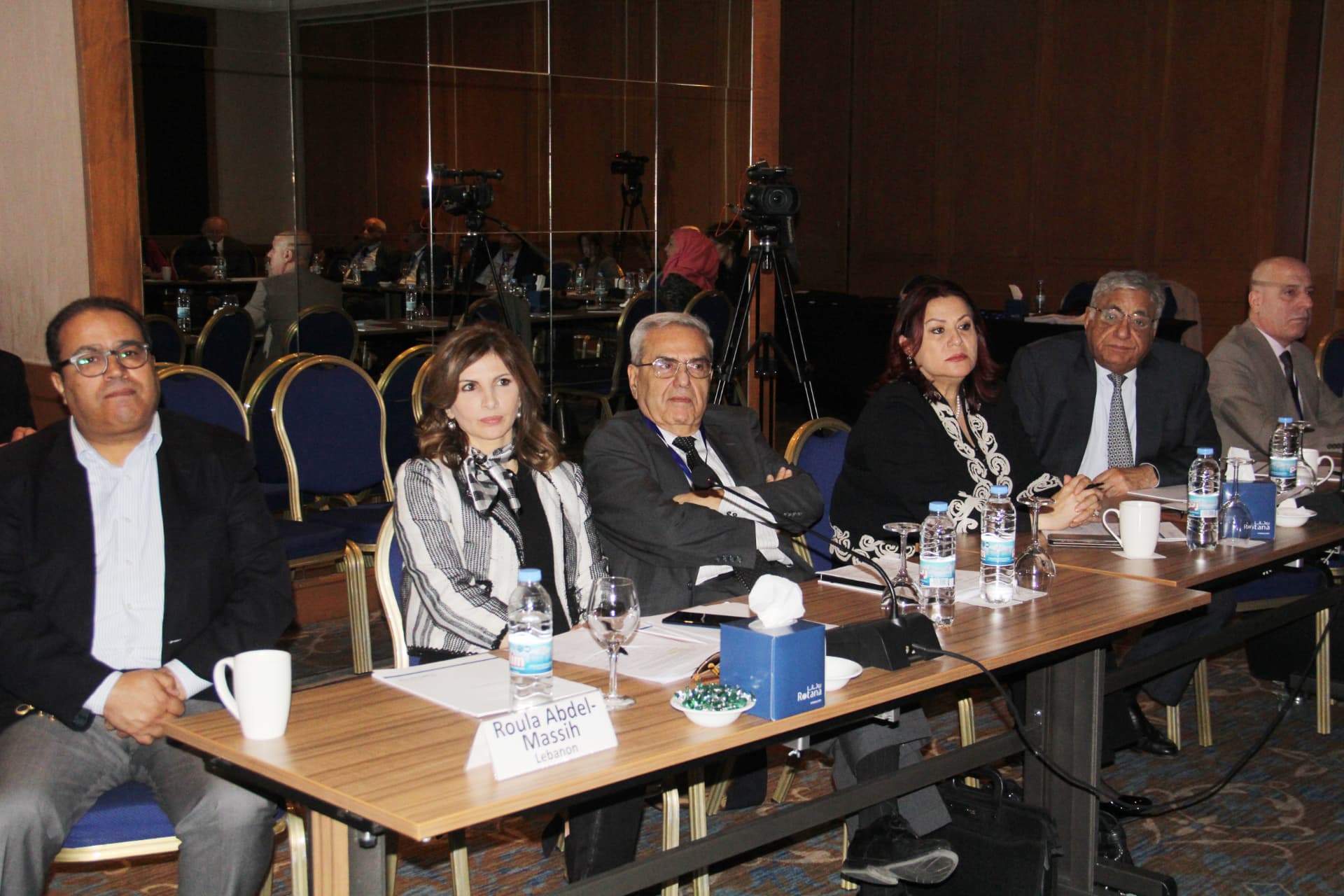Delegates seated at a conference session