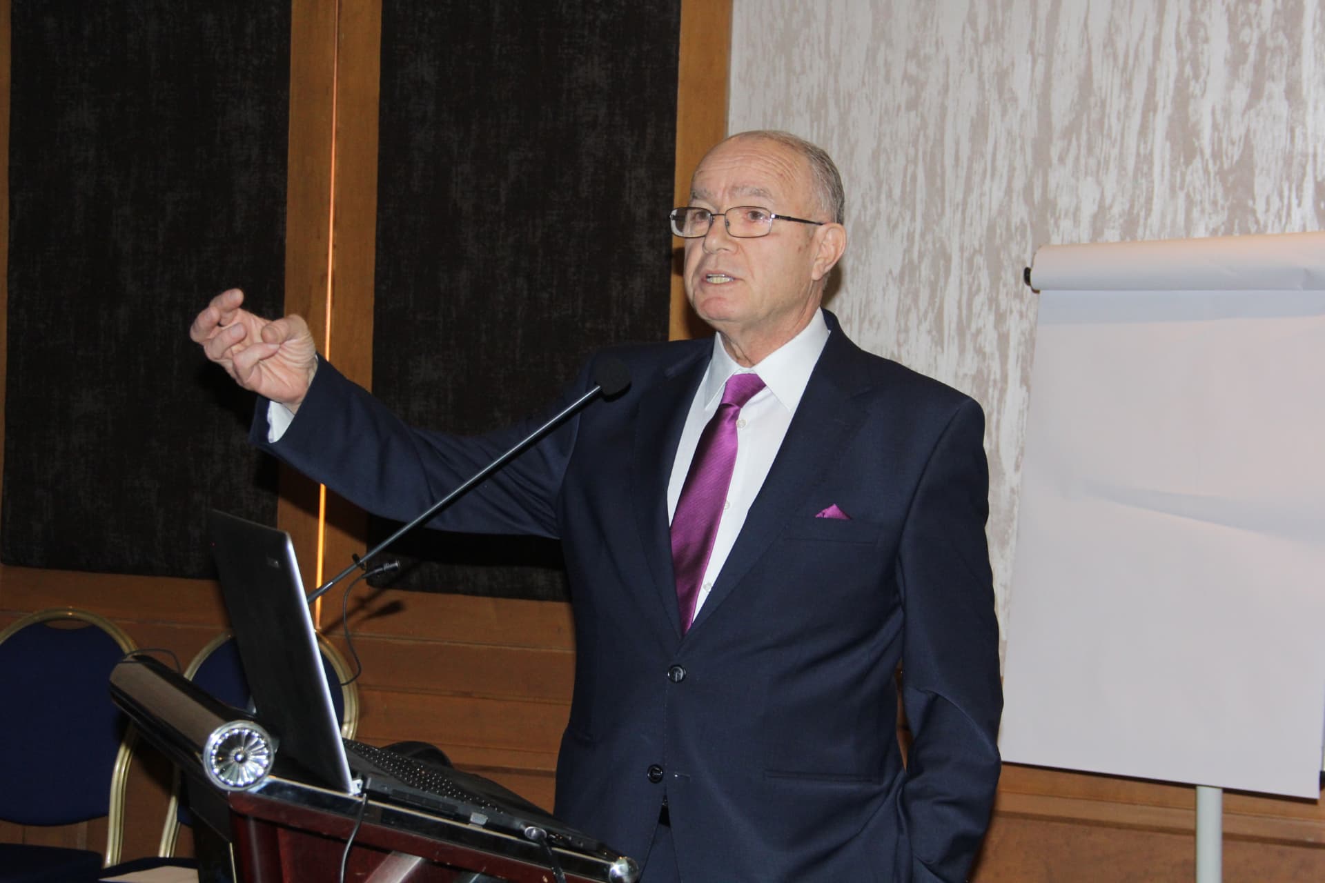 Speaker at the conference lectern
