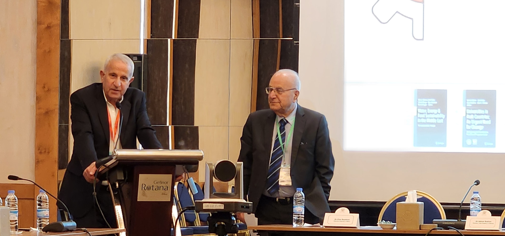 Two speakers at the conference lectern
